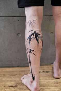 a person with a tattoo on their leg