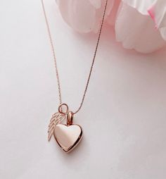 "Due to the very sensitive nature of this purchase, I will do everything I can to make the process simple and seamless. Please note that your piece will be made with much love and light ♥ DETAILS ♥ * Your beautiful keepsake will be made with a combination of Rose Gold Plating over stainless steel and Rose Gold Fill over Sterling Silver. * The heart urn pendant is Rose gold plating over stainless steel and is 5/8\" L by 1/2\"\" at the widest point * The elegant tiny wing pendant is Rose gold fill Rose Gold Charm Necklace With Heart Pendant, Dainty Rose Gold Heart Locket Necklace, Rose Gold Heart Pendant Charm Necklace With Delicate Chain, Rose Gold Heart Necklace With Delicate Chain, Delicate Rose Gold Keepsake Jewelry, Rose Gold Pendant Charm Necklace For Wedding, Delicate Rose Gold Heart Pendant Necklace, Rose Gold Locket Charm Necklaces For Mother's Day, Rose Gold Charm Necklaces With Locket For Mother's Day