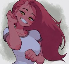 a woman with red hair is smiling and raising her fist