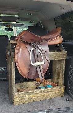 a horse saddle in the back of a car