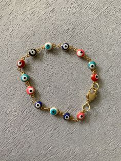 Multicolored Evil Eye Bracelet Size: 7” Long Eye Aesthetic, Bracelets Patterns, Diy Bracelets Patterns, Eye Bracelet, Christmas Mom, Evil Eye Bracelet, Jewelry Inspo, Bracelet Patterns, Bracelet Sizes