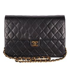 Authentic Chanel front flap bag with quilted calfskin leather. Features black quilted calfskin leather, this luxurious, runway-ready bag features woven-in felt chain strap and 24kt gold plated hardware accents. Its CC snap closure opens to a leather-lined interior with a zip pocket. This Chanel bag is the perfect size for all your essentials. Carry your wallet, cosmetics, cell phone, and more. You're going to love this bag! Ultra rare classic Chanel investment piece. Hologram sticker reads: 4869 Classic Flap Bag With Chain Strap, Timeless Quilted Formal Bag, Timeless Quilted Bag For Formal Occasions, Classic Diamond Quilted Shoulder Bag For Evening, Classic Evening Shoulder Bag With Diamond Quilting, Classic Rectangular Shoulder Bag With Diamond Quilting, Timeless Quilted Shoulder Bag For Business, Timeless Quilted Business Shoulder Bag, Classic Double Flap Bag With Chain Strap