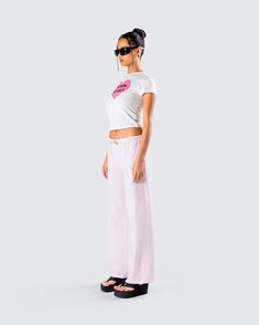 Taking “I woke up like this” to a new level in this two-piece set 💖🙌 Featuring a white jersey graphic top paired with pink stripe drawstring pants, this look will guarantee that you slay every waking moment 😏 Trendy White Cotton Sleepwear, Sporty Pink Summer Sleepwear, Trendy Pink Relaxed Fit Sleepwear, Trendy Pink Cotton Sleepwear, Trendy White Sleepwear For Loungewear, White Sporty Sleepwear With Relaxed Fit, Graphic Top, White Jersey, Cargo Pant