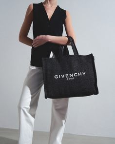 Black raffia tote bag from Givenchy. The G-Tote bag is made of raffia, featuring an internal slot pocket, an open top and two top handles allowing it to be carried over the shoulder.Measurements: L45 x H33 x W12 cmHandle drop: 45cmMade in Italy Raffia Tote Bag, Goals Inspiration, Givenchy Paris, Raffia Bag, Open Top, Givenchy, Carry On, In Italy, Handles