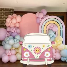 a vw bus is parked in front of balloons