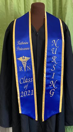 a blue and gold graduation robe with the words rnn class of 2011 on it