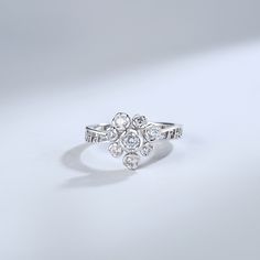 There's nothing as eye-catching as the sparkle of a glistening ring gracefully resting on a woman's hand.Now,you can wear a ring with a beautiful flower design. This simple and engraved ring is sure to be one of your favorites!Weight: 2.97 gHeight: 11 mmMaterial: Plating Color: Silver Open Crystal Ring For Promise, Sparkling Open Ring For Wedding, Dazzling Cubic Zirconia Heart Ring, Fine Jewelry Crystal Ring For Wedding, Promise Flower Open Ring, Brilliant Cut White Gold Flower Ring, Sparkling Crystal Promise Ring In Fine Jewelry Style, Sparkling Open Ring For Anniversary, Sparkling Crystal Promise Ring