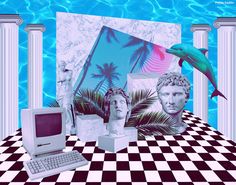 there is a computer and other items on the table in front of some pictures with dolphins