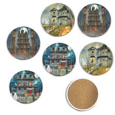 four coasters with houses and pumpkins on them