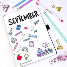 a notebook with the words september written on it next to school supplies and pencils