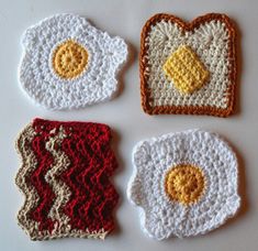 four crocheted coasters with fried eggs on them, one in the shape of a heart