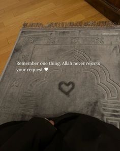 someone is laying on the floor with their feet in front of a rug that says, remember one thing allah never selects your request