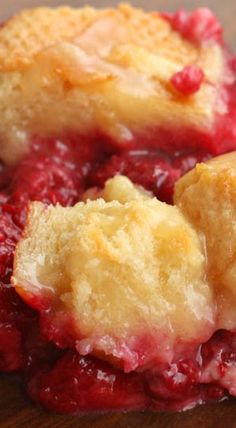 a close up of a piece of pie on a wooden table with crumbs