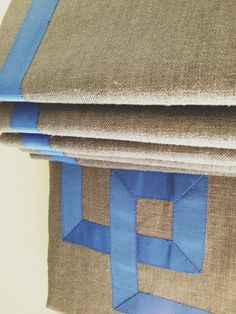 a close up view of some fabric on the side of a chair with blue tape