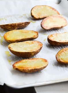 baked potato wedges on a baking sheet ready to be cooked in the oven for dinner