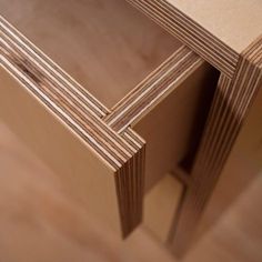 several pieces of plywood are stacked on top of each other in this close up photo