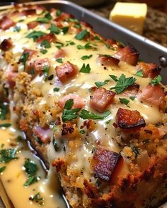 meatloaf covered in cheese and bacon with parsley