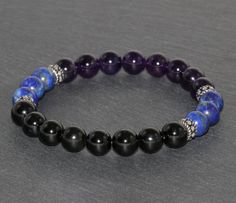 *Black Touurmaline, Lapis Lazuli and Amethyst Beaded Bracelet* IMPORTANT: ♥ Scientifically, Tourmaline is not a single mineral, but a group of minerals with related physical and chemical properties. Tourmaline belongs to a complex family of aluminum borosilicates mixed with magnesium, iron and other various metals that depending on the proportions and components, make up their color. Tourmaline occurs in all colors and is most well known for its pinks, reds, greens and blues, as well as its mult Black Amethyst 8mm Bead Bracelets, Black Amethyst Beaded Bracelets Spiritual, Black Amethyst Bracelets With 8mm Beads, Black Amethyst Beaded Bracelets, Black Amethyst Bracelet With 8mm Beads, Black Amethyst Gemstone Beaded Bracelets, Spiritual Black Amethyst Beaded Bracelets, Amethyst Beaded Bracelet, Garnet Bead Bracelet