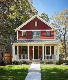 a red house with white trim and windows