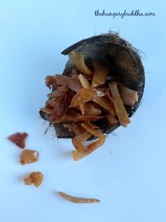 some food is laying on the ground next to it's peels and chips