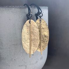 Earrings made of silver and raw brass. The brass has a lightly textured and repoussed surface, allowing the leaves to reflect the light nicely, shining with the natural color of gold. The moving element subtly "sounds" when worn. Leverbacks earwires made of oxidized 925 silver. Length of the leaves is about 3 cm (about 1.18 inches). Length of earrings is ca. 5.5 cm ( approx. 2.16 inches).* It is possible to choose other earwires: hooks or studs (the last photo shows the available types of earwir Gold Electroformed Drop Earrings, Luxury Gold Electroformed Drop Earrings, Gold Hammered Sterling Silver Earrings, Gold Hammered Sterling Silver Linear Earrings, Hand Forged Gold Earrings For Everyday, Minimalist Hand Forged Gold Earrings, Minimalist Hammered Bronze Earrings, Minimalist Hand-forged Gold Earrings, Gold Hand Forged Earrings For Everyday