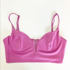 Bustier Deep V Neck Plunge Crop Top Bralette. Sizes Available: 1 Medium In Lilac Pink / Purple Adjustable Straps / Zip Back / Under Wire / Stretchy New With Tags Length: S- 14" M- 14.25" L- 14.5" Pit To Pit: S- 14.5" M- 15.5" L- 16.5" Self: 95% Polyester, 5% Spandex Lining: 100% Polyester Boutique Spring Summer Fall Winter Birthday Party Celebration Travel Vacation Dance Club Date Night Work School City Fashion Casual Spring Party Low-cut Crop Top, Party Triangle Top Bra With Adjustable Straps, Chic Crop Top With Adjustable Straps And Underwire, Party Bra With Adjustable Straps And Triangle Top, Summer Party Bra With Spaghetti Straps, Chic Evening Bra With Triangle Top, Party Bra With Removable Pads And Sweetheart Neckline, Party Bra With Sweetheart Neckline And Removable Pads, Chic Fitted Pink Bra