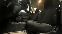 the interior of a car with black leather seats