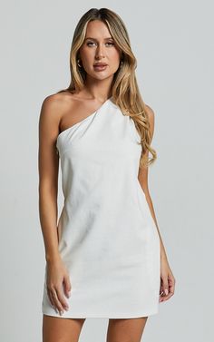 Channel your inner Greek goddess with the Mardelle Mini Dress. This stunning one-shoulder shift dress in crisp white linen will have you feeling like a summer dream. The asymmetric design adds a modern twist to this classic silhouette, while the sleeveless style keeps it effortlessly cool and perfect for those warm days or festival vibes. Whether you're heading to a casual brunch or dancing the night away, this shift dress is versatile enough to take you from day to night with ease. Embrace your Casual Festival, Red Sequin Dress, Basic Black Dress, Neon Outfits, Bachelorette Dress, Spring Maxi Dress, Navy Bridesmaid Dresses, Exude Confidence, Dress Linen