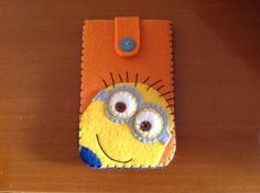 a cell phone case made to look like a minion