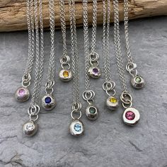 These unique tiny silver nugget pendants have been handmade using recycled offcuts and trimmings from my other sterling silver pieces. I melt the silver until it forms a pleasing nugget shape, solder on the fixings then after cleaning and polishing I set sparkly 3mm gemstones into them. These are great for individual birthstone necklaces, for bridesmaids gifts or a treat for someone special.  These pendants are made to order so every one of them will be unique. The gemstones may differ in colour Birthstone Necklaces, Recycled Silver, Silver Pieces, Matching Bracelets, Silver Chain Necklace, Birthstone Necklace, Bridesmaids Gifts, Pendant Set, Handmade Silver