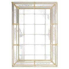 an ornate gold framed mirror on a white background