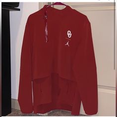 University Of Oklahoma X Jordan Jacket Nwt Red Fleece Long Sleeve Outerwear, Red Fleece Crew Neck Outerwear, Red Fleece Outerwear With Crew Neck, Fall Red Sweatshirt With Pockets, University Red Long Sleeve Track Jacket, University Red Long Sleeve Hoodie For Fall, Casual University Red Track Jacket For Winter, Jordan Pullover, Jordan Jackets