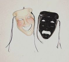 two masks with faces painted on them, one is black and the other is white