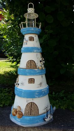 a white and blue tower with a light on top