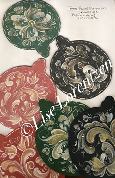 four decorative paper plates with different designs on them