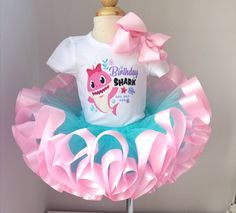 a pink and blue birthday shark tutu with a t - shirt that says happy birthday shark on it