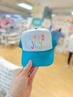 Chasing Joy Trucker Hat - Hat Playful One Size Visor Hats, Fun Curved Brim Hats For Baseball Season, Fun Curved Brim Baseball Hats, Playful Blue Trucker Hat For Summer, Fun Baseball Cap For Baseball Season, Playful Blue Summer Trucker Hat, Playful Blue Trucker Hat, One Size Fits Most, Playful Outdoor Trucker Hat With Curved Brim, Playful Curved Brim Trucker Hat For Outdoor