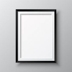 a black frame hanging on the wall with a blank space in it for an image