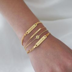 Dainty and masculine, this engravable id bracelet features a sleek bar on a cuban chain. Perfect for layering with other bracelets or worn alone. Gold Vermeil Plate measurement: Width 1in (2.6cm) x Height 0.2in (0.5cm) Italian Figaro chain, width 1.5mm Length: 6-7in (15-18cm), 7-8in(18-20cm) Laser Engraving Handcrafted in NYC Hypoallergenic, lead and nickel free #B191 Engraving Bracelet, Engraved Bar Bracelet, Personalized Gold Bracelet, Sleek Bar, Custom Engraved Bracelet, Disc Bracelet, Gold Bracelet For Women, Figaro Chain, Engraved Bracelet