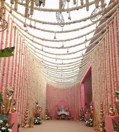 a pink and white decorated hall with lots of decorations