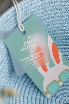 a blue sweater with an easter bunny tag attached to it