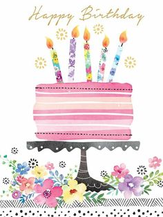 a birthday cake with candles and flowers on it