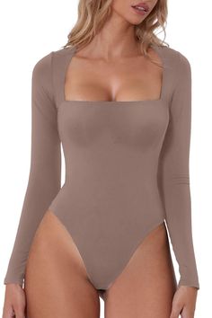 PRICES MAY VARY. Material:Designed in our premium polyamide high-stretch, and breathable fabric that’s dual layered for a compressive fit, can be relied upon to create a flattering silhouette and and wraps itself around your body like a second skin. Feature:the square neck bodysuit features with a square neckline and curved shoulders for a bust flattering fit,Ultra versatile with a high cut, brazilian bottom that can be styled perfectly under jeans and trousers. This sculpting, smoothing square Bodysuit Outfit, Bodysuit Tops, Flare Jumpsuit, Square Neck Bodysuit, Bodysuit Top, Shapewear Bodysuit, Bodysuit Fashion, Tops Black, Womens Bodysuit