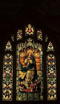 an ornate stained glass window in a church