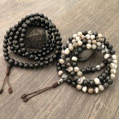 Beautiful black and mix Agate Japa Mala from Nepal. You can choose between the Black Agate mala and the Mix Agate mala necklace. A unique praying mala that can be used as a necklace or as an ornament. The mala has no clasp, you wear it over the head. The mala necklace is 42.5cm- 16.75 inch long A most have addition to your jewelry collect To see more unique Mala necklaces click the link below https://www.etsy.com/shop/AkashiJewelry?ref=seller-platform-mcnav&section_id=18307945 Enjoy Con salu Black Agate Necklace, Buddhist Mala, Wiccan Necklace, Tigers Eye Necklace, 108 Mala Beads, 108 Bead, Skull Necklace, Black Agate, Mala Necklace