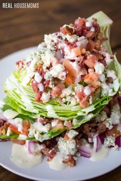 lettuce and bacon salad on a white plate