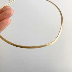 Estate/ vintage 14KT yellow gold neck wire/ collar necklace with one side matte finish, and other is hammered. Slight drip in front of the collar. Length: 16.5” Width: 3mm Weight: 28.5 grams Hook closure Solid/ stiff collar Excellent condition No longer stamped, but fully tested 14KT Modern Matte Gold Hammered Jewelry, Elegant Hammered Choker Jewelry, Elegant Hammered Choker Necklace, Collar Necklace, Dip, Yellow Gold, Collar, Yellow, Gold