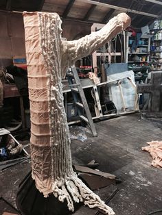 a sculpture is being made in a workshop