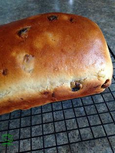 a loaf of bread sitting on top of a cooling rack