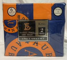 an orange, blue and black bed sheet with the number five on it